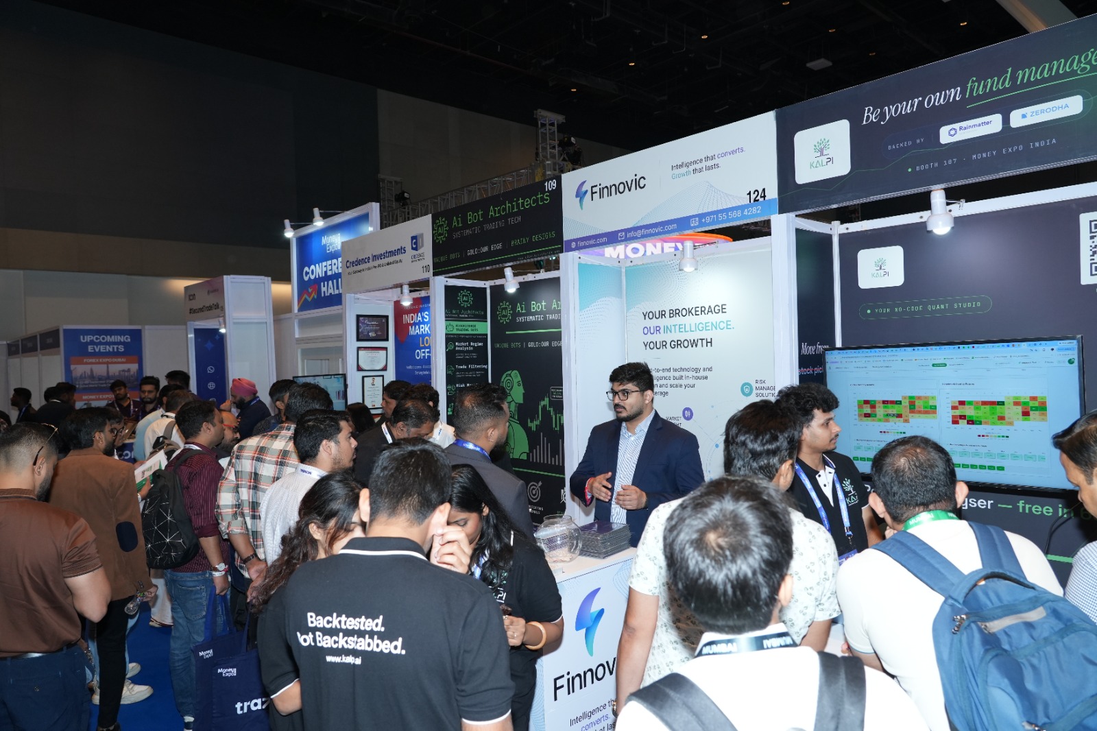 Visitors filling the exhibition aisle beside the Finnovic stand at Money Expo India 2026